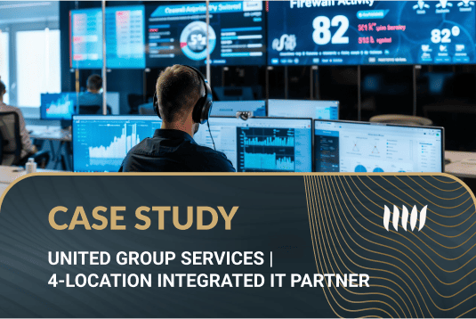 IT support professional monitoring network activity and data security in a modern control room, United